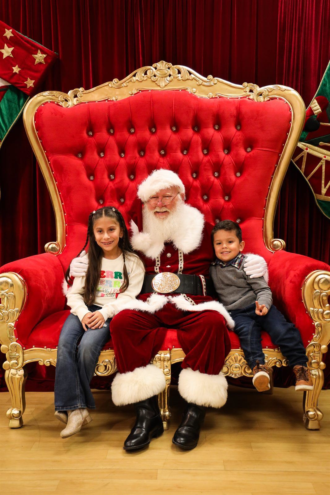Santa with two children at the Festival of Lights