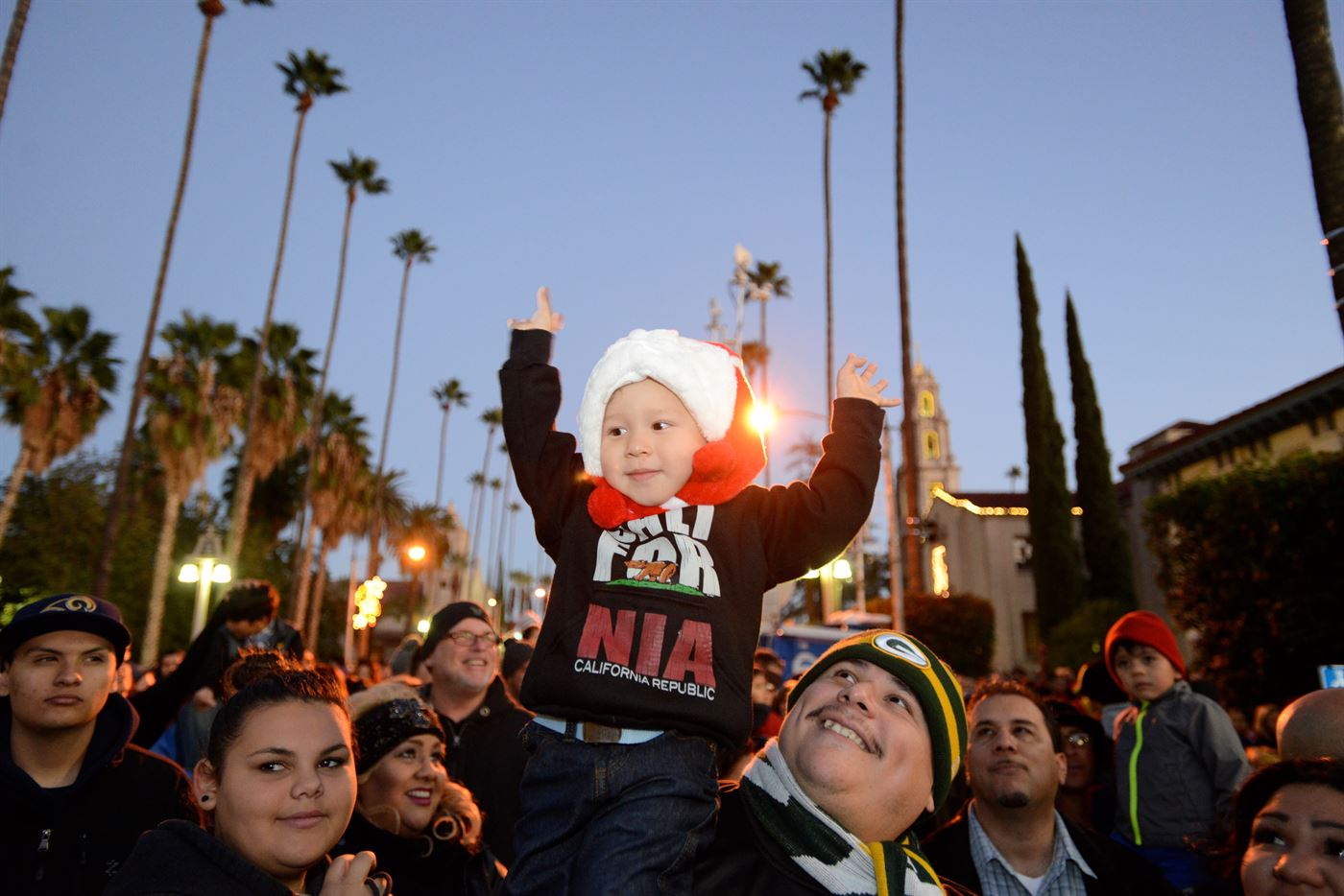 Child wearing a Santa hat at Festival of Lights