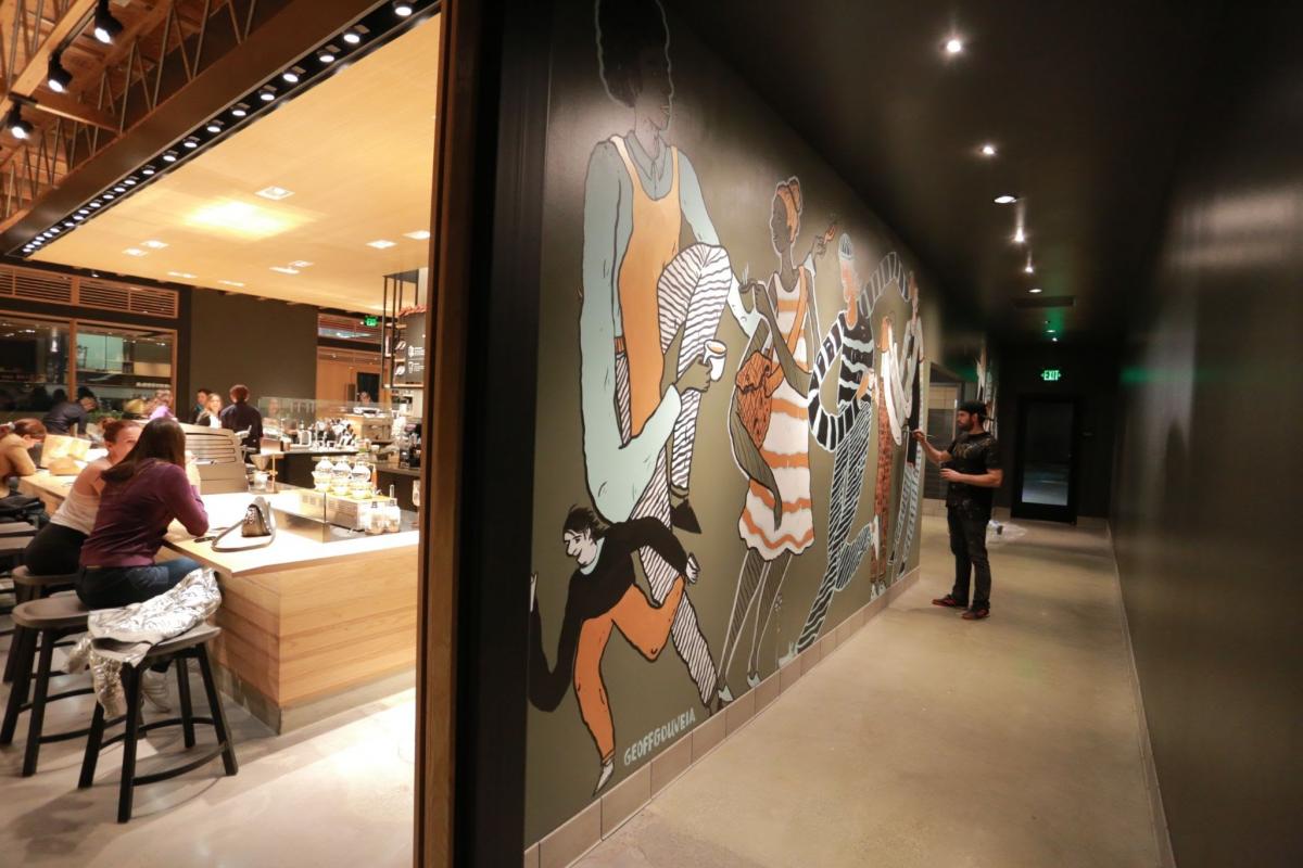oeff Gouveia while painting an original mural inside a Starbucks Reserve store. Courtesy Goeff Gouveia