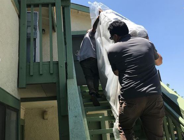 Mattress being carried in