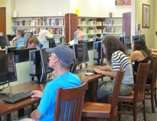 Residents using library computers 