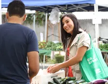 Resident using Go Green Reusable Bag 
