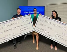 Riverside Regional Fast Pitch Winners receive checks. 