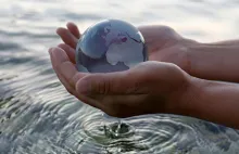 hand holding small globe