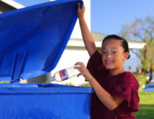 Child with recycle bin